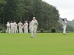 81 year old batter walking back off the cricket field