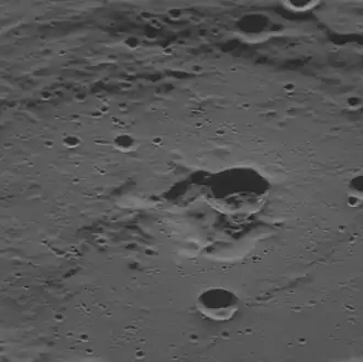 Oblique view facing west with the dark interior crater near center