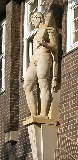 Male figure with hammer by Hans Wagner