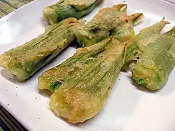 Hobak-kkot-jeon (pan-fried stuffed Cucurbita moschata flowers)