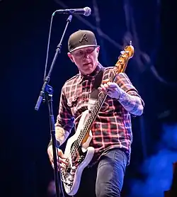 A man playing a bass guitar