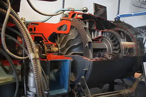 A centrifugal stage has diffuser vanes, which slow the airflow after it leaves the tip of the impeller, visible in this Turbomeca Artouste engine. They contribute to the stage pressure ratio.