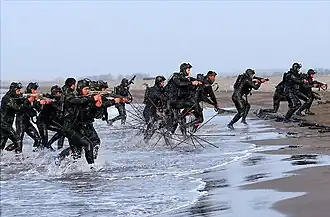 IRGCN frogmen mostly equipped with Z-84 submachine guns in an amphibious exercise of Great Prophet IX war games exercise.