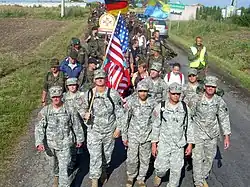 Eight Illinois guardsmen walk with Polish and German Soldiers during an annual pilgrimage from Warsaw to Czestochowa