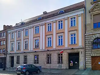 The Ionic Palace, a neoclassical tenement house from the 18th century at 3 White Eagle Square, alongside Staromłyńska Street.