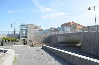 The new southern entrance with escalators, stairs, and waiting area