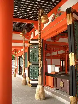 Suzu hanging under the eaves of a Shinto shrine