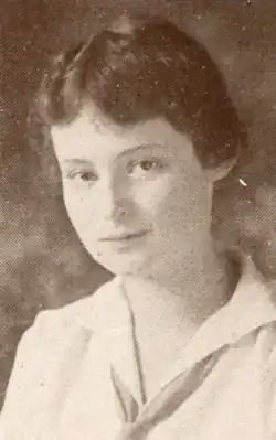 Jeanette Einstein, a young white woman with dark hair parted center, wearing a white blouse