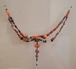 Jewelry with components from the Indus, Central Asia and Northern-eastern Iran found in Susa dated to 2400–2100 BC. Louvre - SB 13099; N 601.