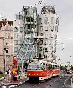 Prague Tatra T3R.P tram in front of the Dancing House