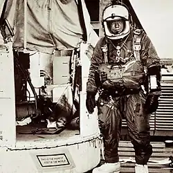 Joseph Kittinger next to the Excelsior gondola. The plaque reads "This Is The Highest Step In The World".