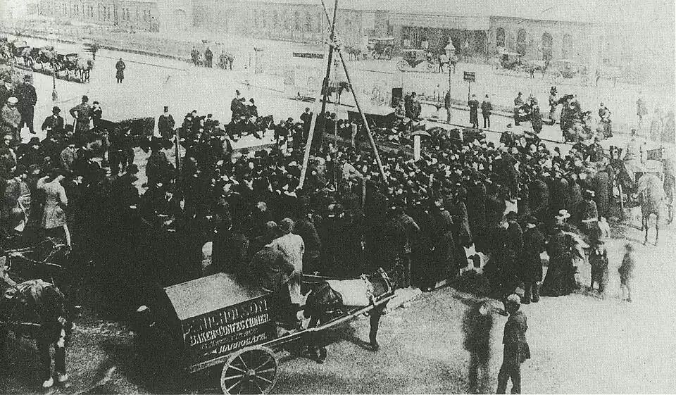 The crowd at the laying of the foundation stone, 1887. The A-frame supported the pulley which lowered the stone.