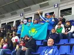 Spectators with the Kazakh flag