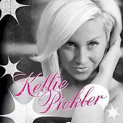 A black-and-white photo of Kellie Pickler surrounded by bulb flashes. The artist's name appears below her, cursively written in pink.