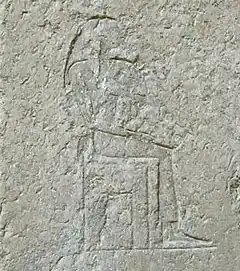 wornout relief of a seated woman