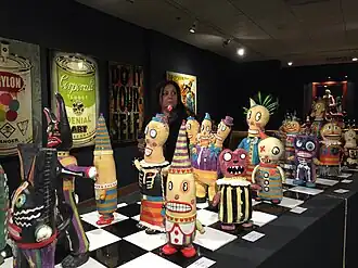 Kirsten Abrahamson and her various ceramic sculptures of robots at Jonathon Bancroft Snell Gallery, October 2015. Photo taken by her loving daughter.