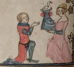 A knight in red receiving a helmet from a damsel in pink, from an English manuscript of The Romance of Alexander (1338–1344).