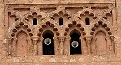 Blind interlacing multifoil arches on the Almohad minaret of the Kutubiyya Mosque in Marrakesh, Morocco (12th century)