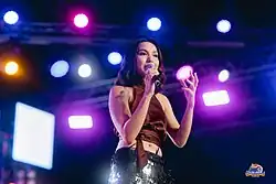 A picture of Kyline Alcantara performing on stage