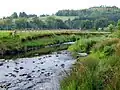 Land erosion just downstream of Bankfoot, which can be seen in the background