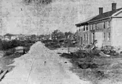 Black and white image of a railroad track under construction