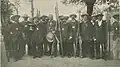 The men's team of the Fishermen Society of Amiens surrounding Elie Lesueur holding his trophy of "champion of the world"[22]