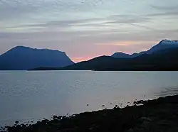 Lochan Fada at sunset. In the distance are Beinn Lair on the left and A' Mhaighdean on the right.