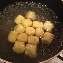 Gnocchi are boiled to cook them.