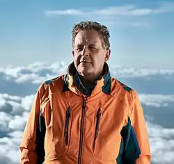Photo of Matt Mountain against a backdrop of clouds