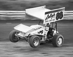 Sprint car performing a wheelie