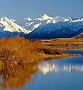 McClure Peak centered on skyline and reflected in Lake Clearwater
