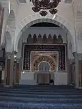The Mihrab (Prayer niche) where the Imam stands and leads Islamic congregational prayers (Salah)