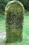 1754 German forest boundary stone set up in 1754; it marks one end of a line of 65 boundary stones between the Hanoverian state forest and the woods held in common by local villages. The border was marked by order of George II of Great Britain who was also Elector of Hanover at that time.