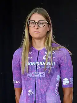 Monica Trinca Colonel wearing a purple cycling jersey that says "Bongioanni" across the chest.
