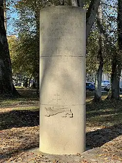 Large stone pillar commemorating Charles De Gaulle's visit to Bayeux