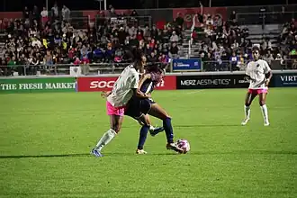 Shaw playing against North Carolina Courage in Cary, North Carolina, October 2024.