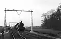 NS 6106 with a goods train during electrification work. (1952)