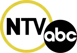 In a large white circle with a yellow border, the letters N T V, with the N in bold. The ABC network logo, a black disk with the letters a b c, overlaps it on the lower right.