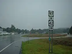 A intersection where NY 42 and NY 97 split into two different roads, located in Sparrow Bush, New York