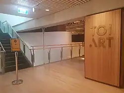 Sign, corridors and stairs at the entrance of the art gallery