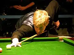 Neil Robertson playing a shot on the pink ball.
