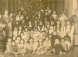 A New Year's tree in the house of Bala bey Ashurbeyov.In the bottom raw the first from the left side-Rasgad bey, the third-Sitara khanim, the fourth-Sara khanim, the fifth-Maryam khanim.