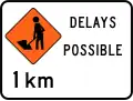 Road workers ahead in 1 kilometre, delays possible