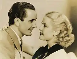 still frame from movie depicting Nino Martini and Anita Louise