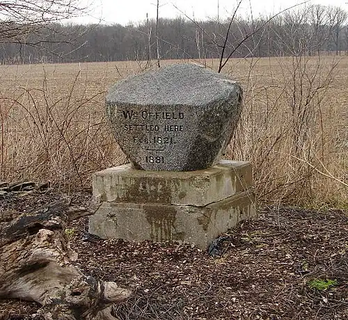 Offield Monument on road near creek