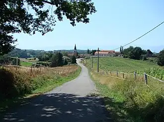 Entrance to the village church on the left, right school