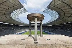 Traditional Olympic cauldrons often employ a simple bowl-on-pedestal design, such as the cauldron used for the 1936 Summer Olympics.