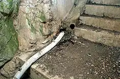 Aerial tube at junction of stairways