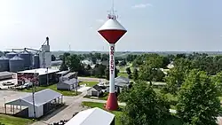 Orient water tower, with a wind farm in the background