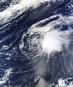 Satellite imagery of a disorganized tropical cyclone in the central Atlantic on October 4